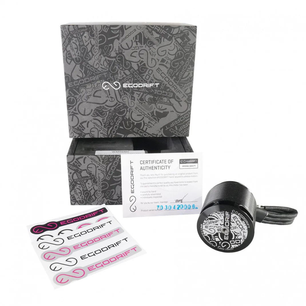 Packshot of EGODRIFT 4230EC Eclipse motor with unpacked decal sheets and Certificate of Authenticity