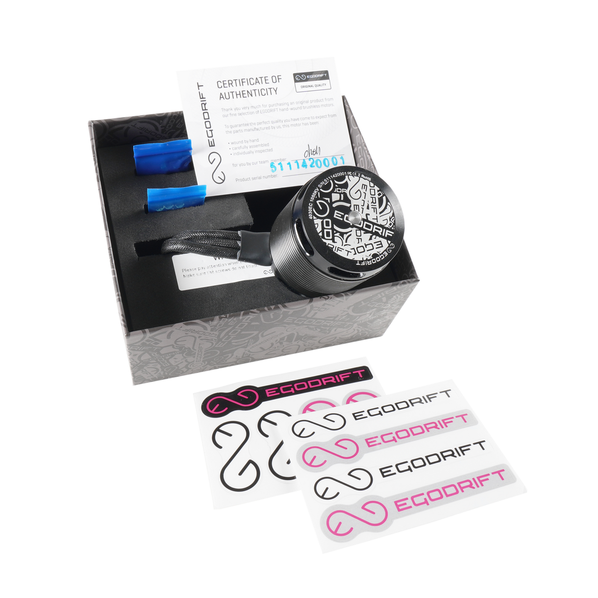 Opened box of the EGODRIFT Tengu 4030EC Eclipse motor with decal sheets on transparent background